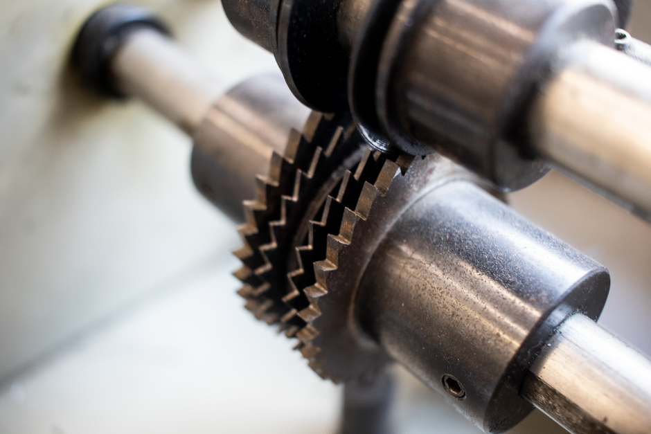 Detailed view of interlocking metal gears in industrial machinery.